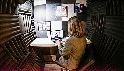 Benefits of Coworking: Boost Productivity & Collaboration 9 Video Meeting in Phone Booth