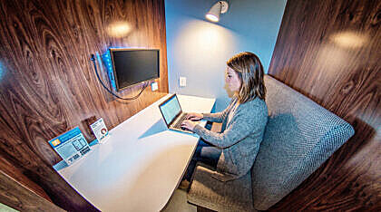 Benefits of Coworking: Boost Productivity & Collaboration 14 Person Working Inside Private Booth